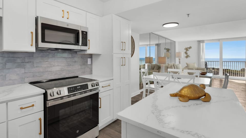 BeachCrest 204: Renovated kitchen and dining/living room with TV