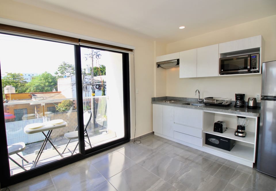 Deluxe Loft, City View | Private kitchenette | Full-size fridge, microwave, toaster, blender