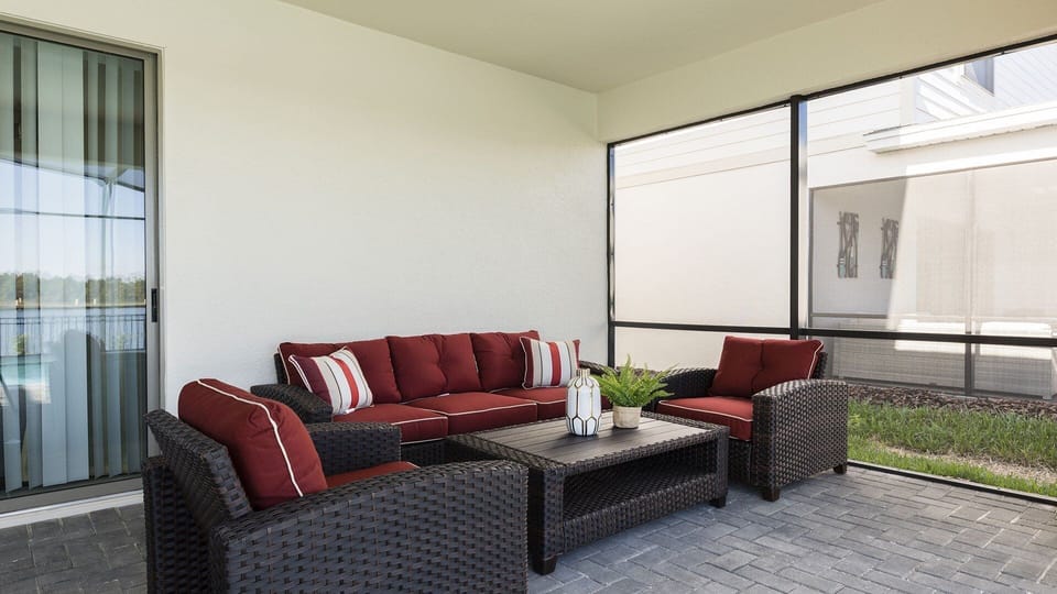 Enjoy outdoor comfort with seating by the pool, offering a relaxed and inviting space