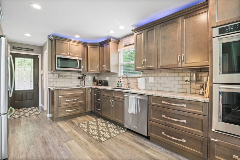 Updated kitchen with stainless steel appliances, double oven