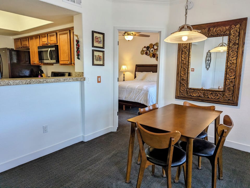 Entrance to primary bedroom is next to dining nook.