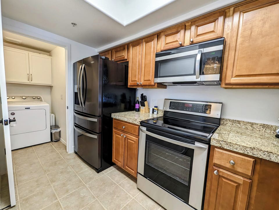 Kitchen with laundry room door open.