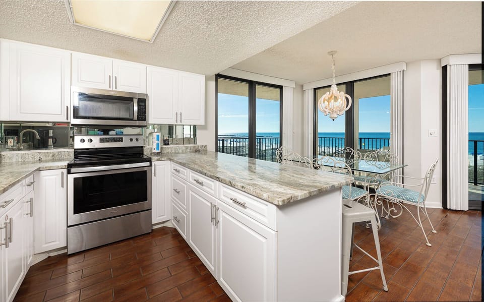 Prepare meals while enjoying the coastal views from the kitchen, where family traditions come to life