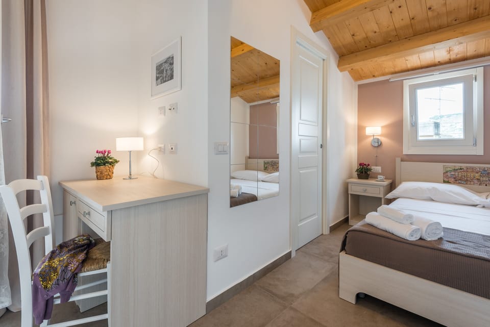 Panoramic Double Room | Down comforters, minibar, individually decorated, individually furnished