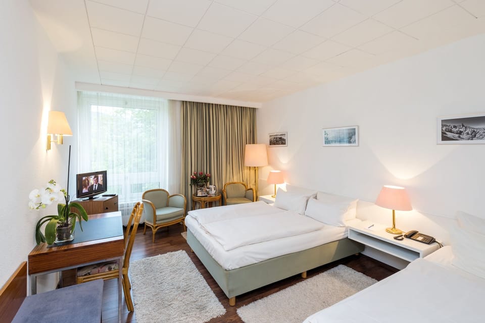 Triple Room | Minibar, desk, blackout drapes, iron/ironing board