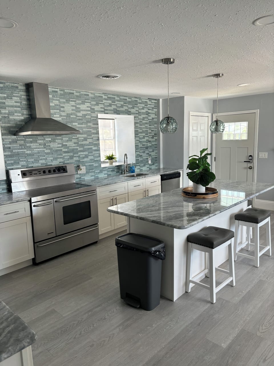Front entrance and kitchen open to the living area
