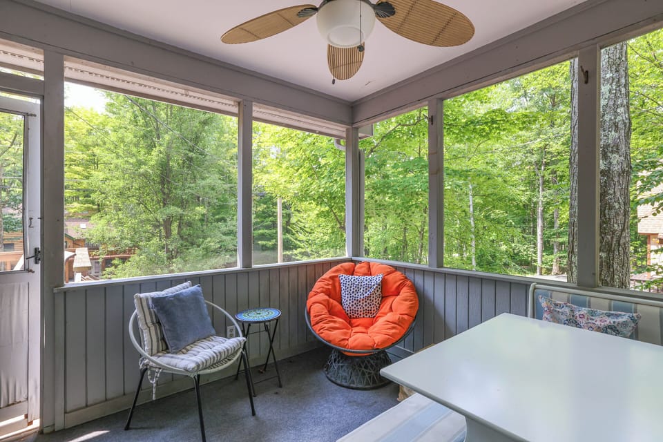 Screened in porch with dining area and TV
