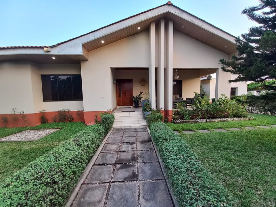 The front lawn is a colourful oasis that greets you with lush greenery.