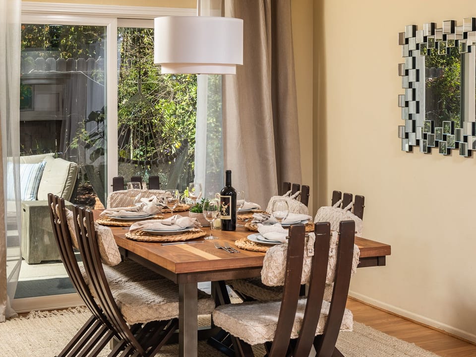 dining table seats 6 plus with all new table setting chargers, plates etc.