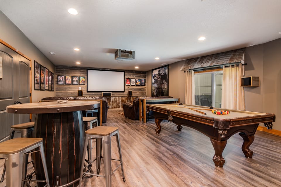 Fun for everyone in this game room with pool, poker table, and movie screen!