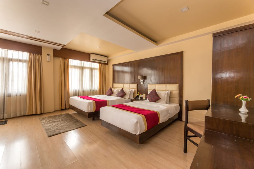 Deluxe Triple Room | Down comforters, Select Comfort beds, minibar, in-room safe