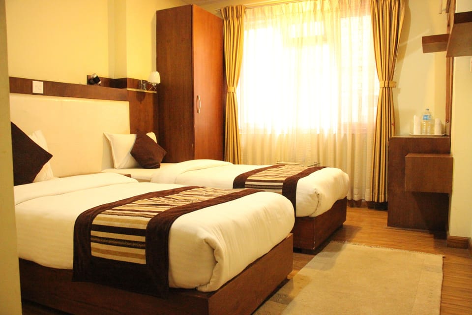 Deluxe Twin Room | Pillowtop beds, individually decorated, desk, blackout drapes