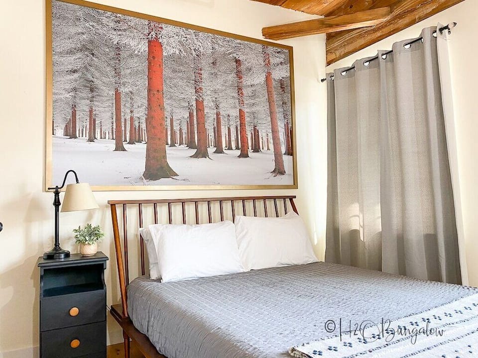 Queen bed #1 - The adventurer in you will dream of autumn gold and forest trails, while resting on fresh crisp linens.