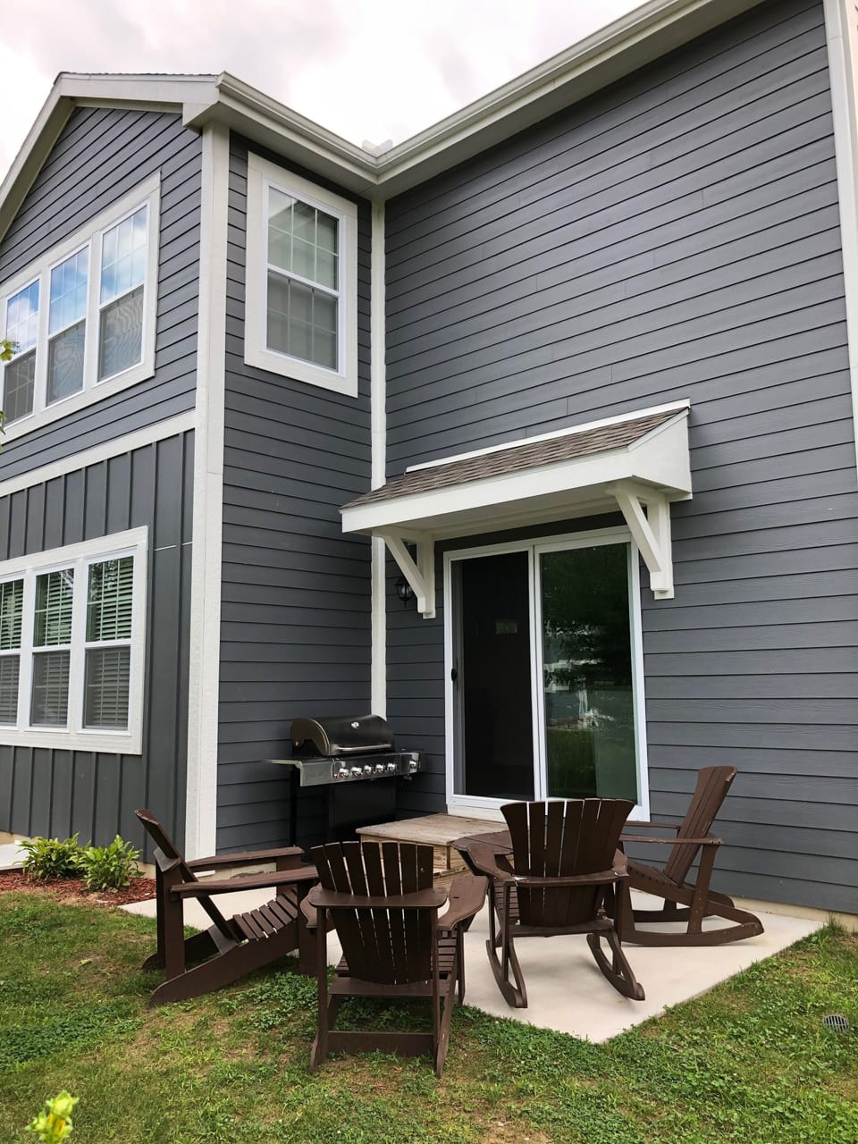 Back patio has comfortable seating and a gas grill for cooking.  