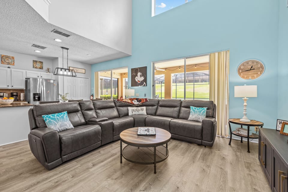 Living room with 65" Smart TV overlooking pool