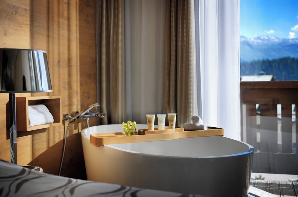 Hypo-allergenic bedding, down comforters, minibar, in-room safe