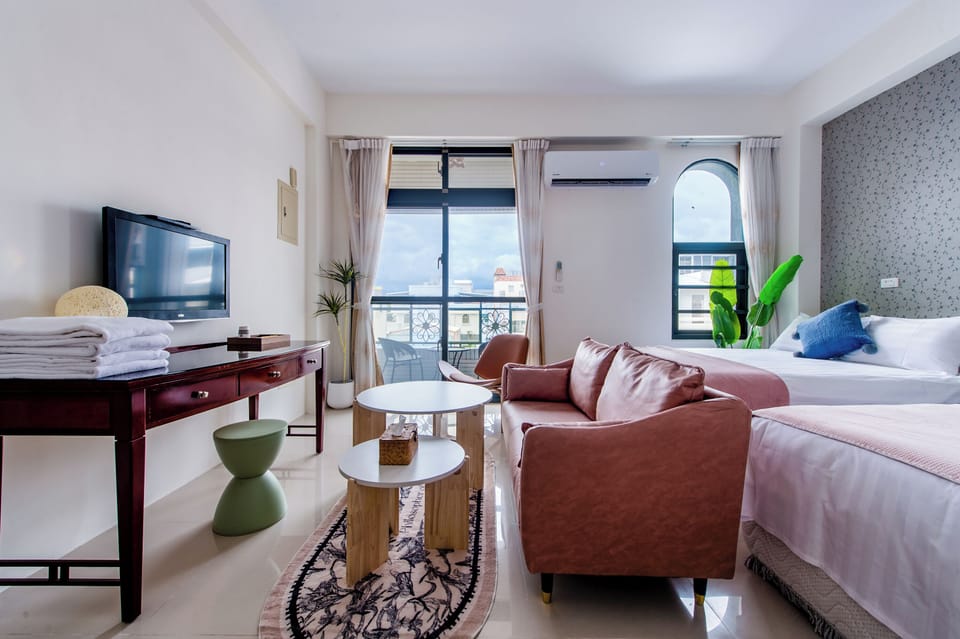 Deluxe Quadruple Room, Balcony | Free WiFi, bed sheets