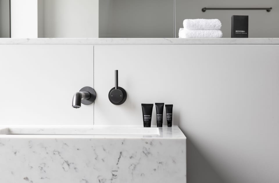 Shower, rainfall showerhead, designer toiletries, hair dryer