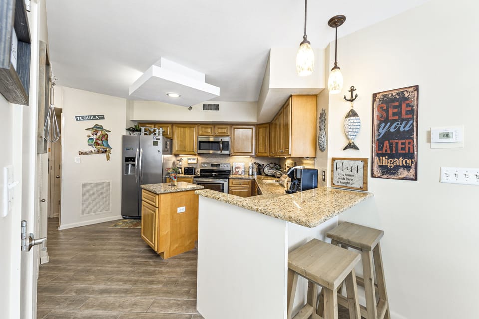 Updated Kitchen with Stainless Steel Appliances, Granite Counter Tops and a Breakfast Bar