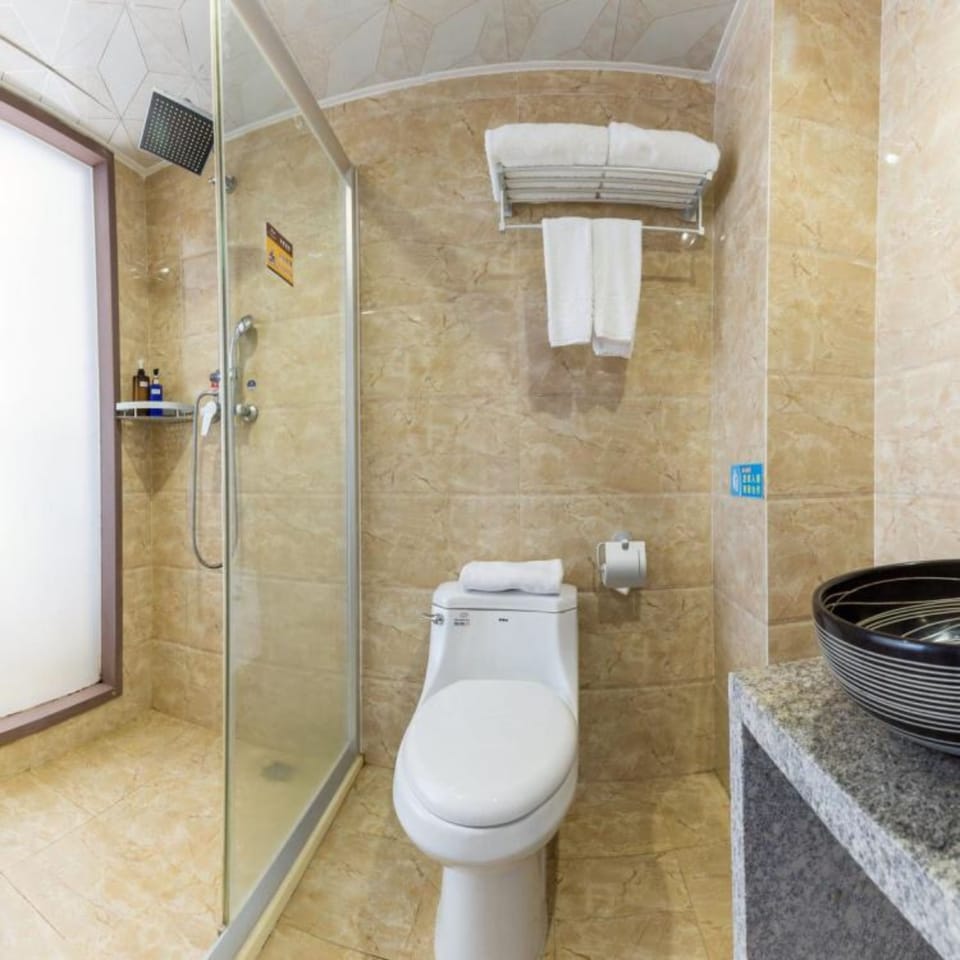 Shower, free toiletries, hair dryer, slippers