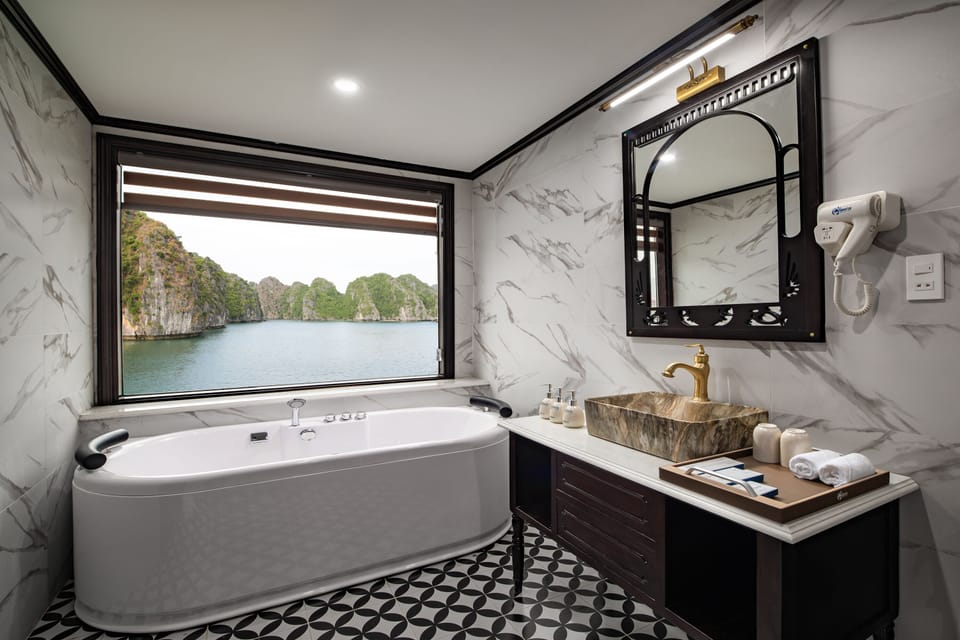 Shower, designer toiletries, hair dryer, bathrobes