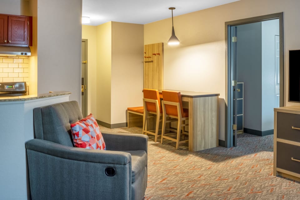 Premium bedding, desk, laptop workspace, blackout drapes