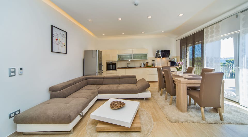 Family Villa | Living area | 80-cm flat-screen TV with satellite channels, LCD TV, DVD player