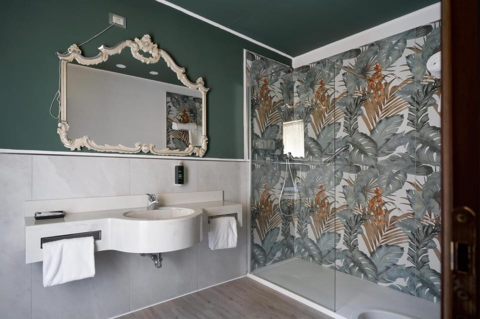 Superior Room, 1 King Bed | Bathroom | Combined shower/tub, hair dryer, slippers, bidet