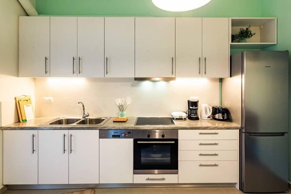 Modern Kitchen Setup with Oven, Stovetop, and Ample Storage Space