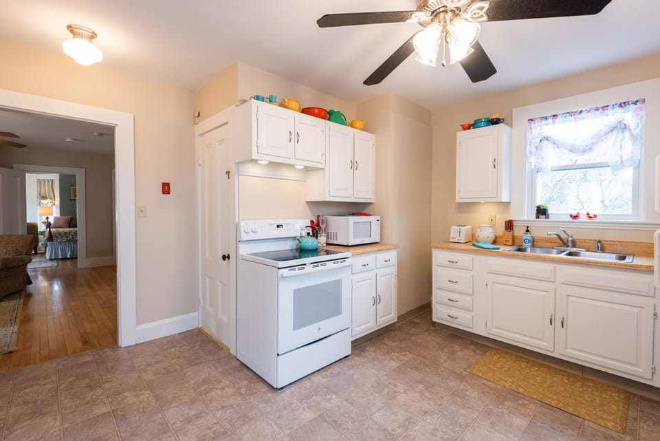 A fully equipped kitchen offers a place to cook meals.