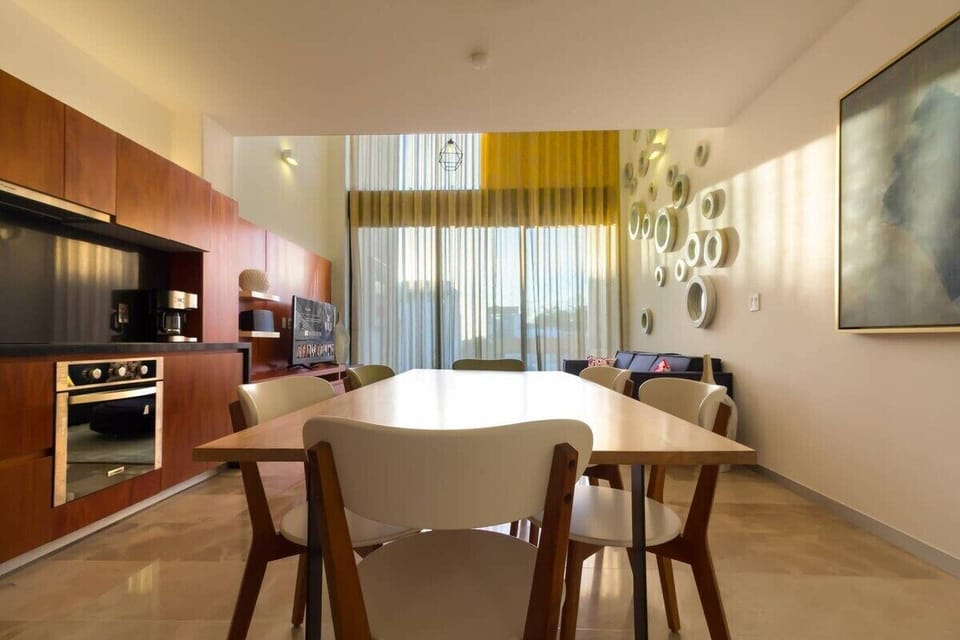 The dining space overlooking the living area and terrace.