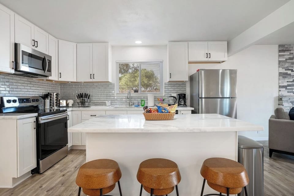 Fully stocked kitchen with countertop for easy meal preparation.