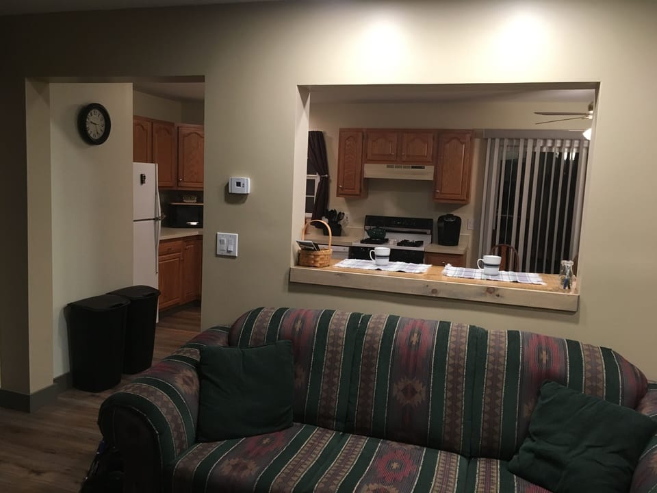 View from the living room through the breakfast nook into the full size kitchen 