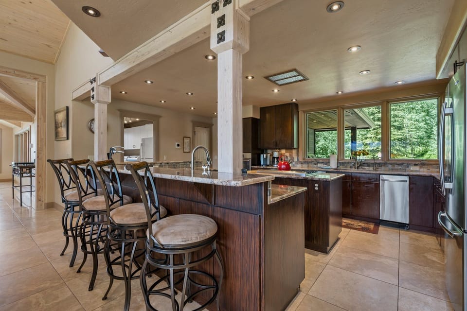 Fully Stocked Gourmet Kitchen w/ Bar Seating