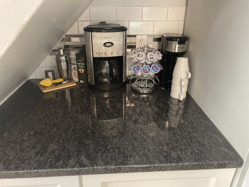 Some coffee and coffee k-cups provided.