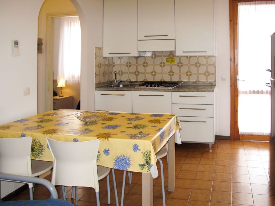 Room, Furniture, Property, Kitchen, Countertop, Dining Room, Floor, Interior Design, Table, Yellow