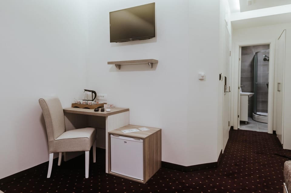 Superior Triple Room | Living area | 32-inch Smart TV with cable channels, TV