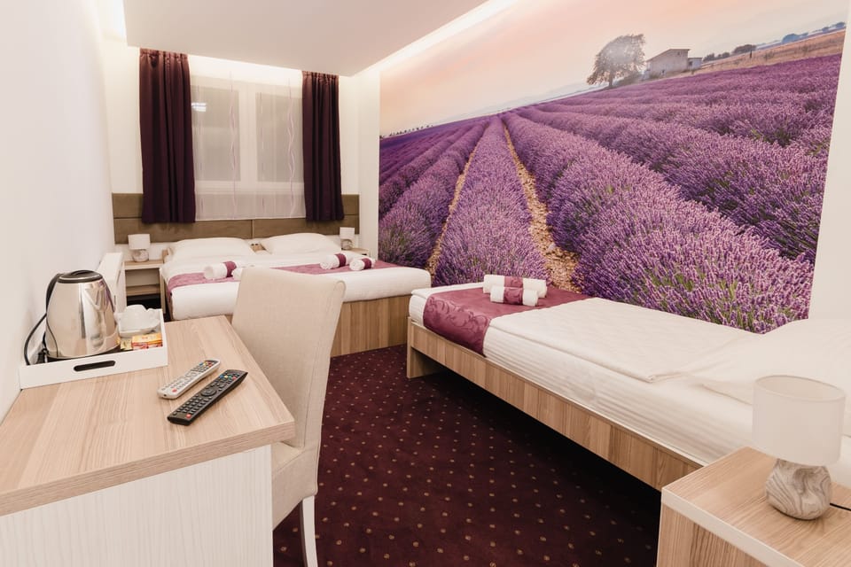 Superior Triple Room | Minibar, in-room safe, individually decorated, individually furnished