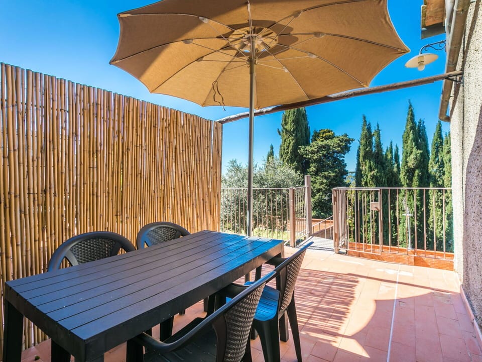 Furniture, Property, Table, Sky, Building, Umbrella, Light, Azure, Nature, Shade