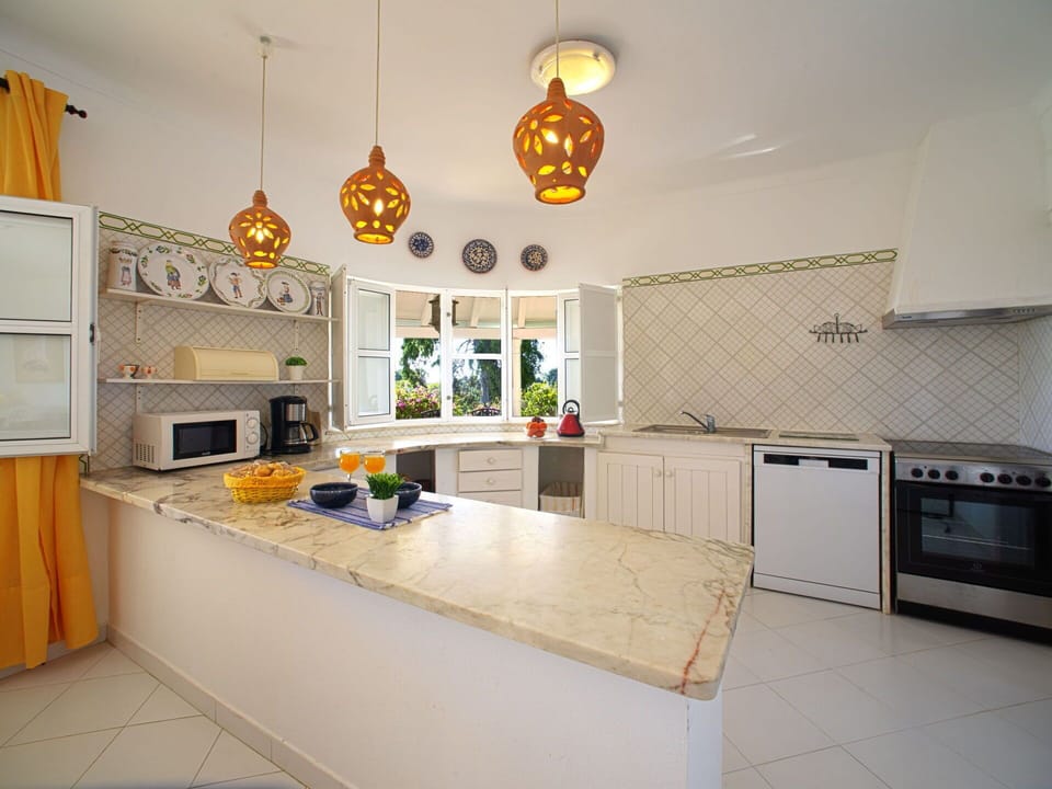 Cabinetry, Countertop, Kitchen Appliance, Kitchen Stove, Kitchen, Lighting, Gas Stove, Interior Design, Home Appliance, Wood