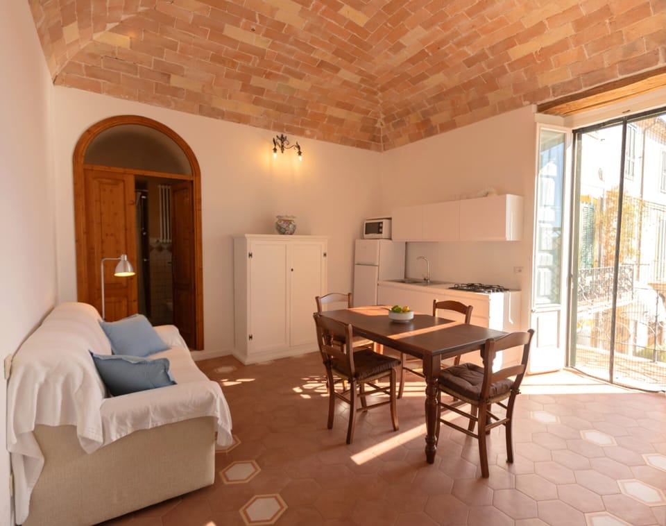 Glicine Apartment with terrace, mountain view | Private kitchen | Microwave, electric kettle, highchair, cleaning supplies