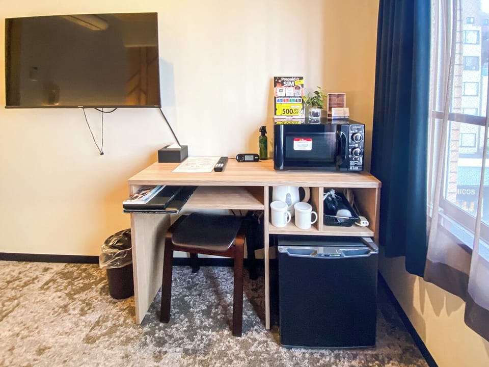 Desk, blackout drapes, free wired internet, bed sheets