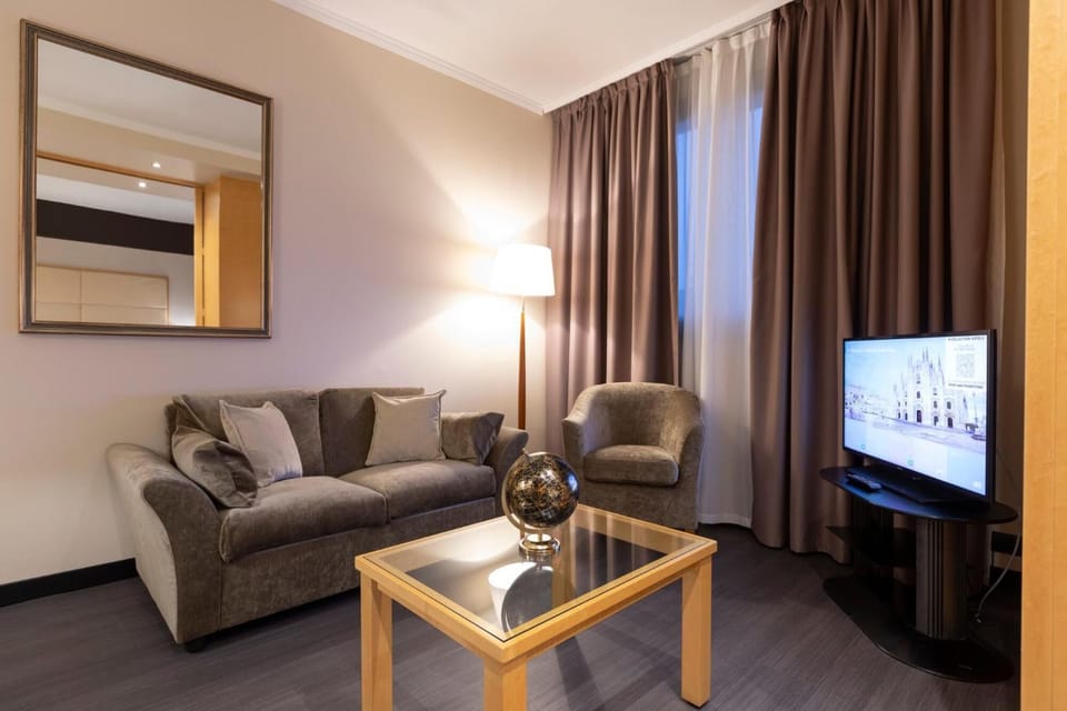 Suite | Living room | 26-inch LCD TV with satellite channels, TV