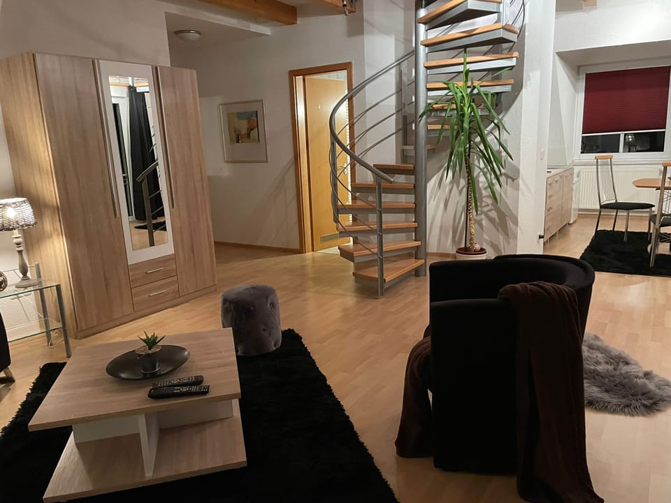 Family Studio Suite | Living area | Flat-screen TV, table tennis, toys, books