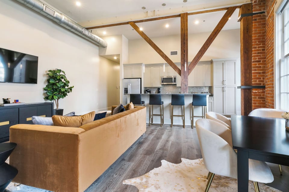 Open concept living, kitchen, dining area with lots of comfortable seating for you and your guests. 65” Samsung Smart 4K TV for streaming from your favorite apps, along with the DIRECTV. Dining table with seating for four. All the natural light too!