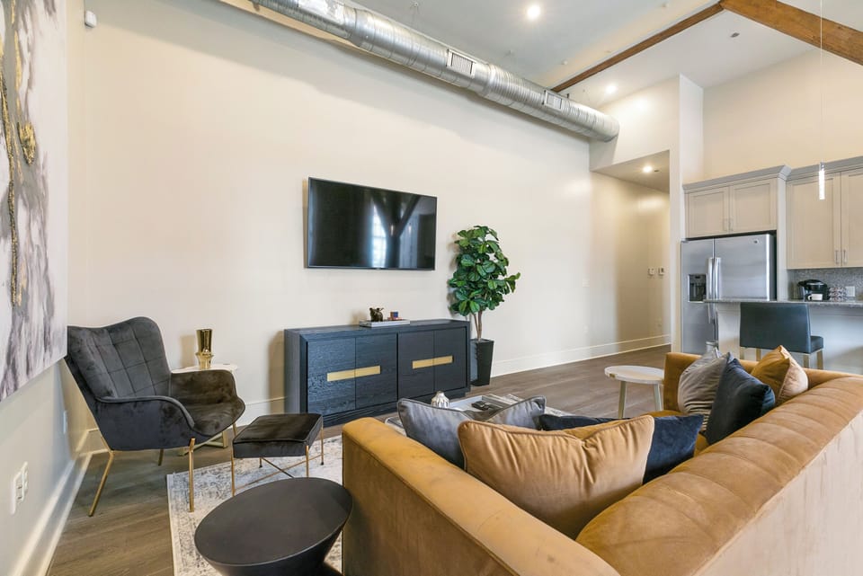 Open concept living, kitchen, dining area with lots of comfortable seating for you and your guests. 65” Samsung Smart 4K TV for streaming from your favorite apps, along with the DIRECTV. Dining table with seating for four. All the natural light too!