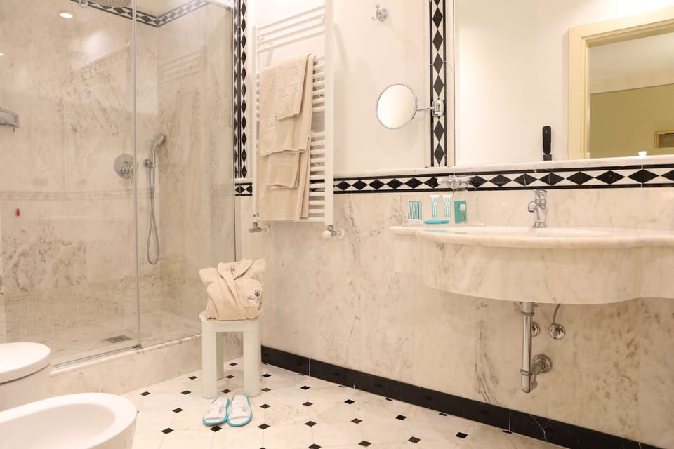 Deluxe Triple Room | Bathroom | Hair dryer, slippers, bidet, towels