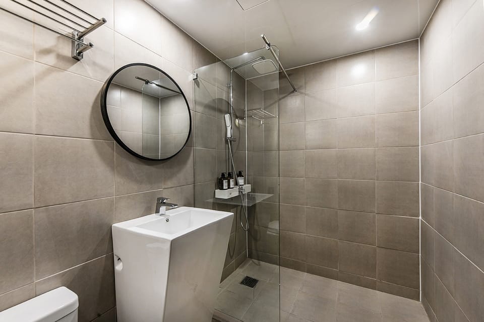 Designer toiletries, hair dryer, bathrobes, slippers