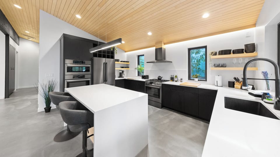RAVN HAUS - Canopy - Kitchen Island Sink Range Fridge Oven Wine Glasses _ VRBO