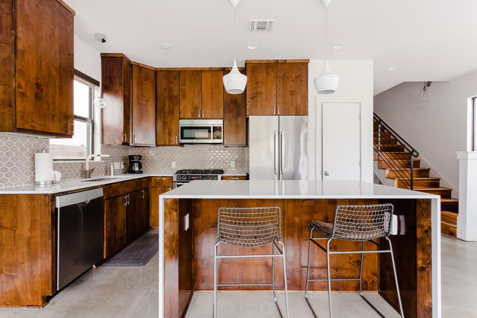 Fully equipped kitchen with coffee maker. Quartz counter tops